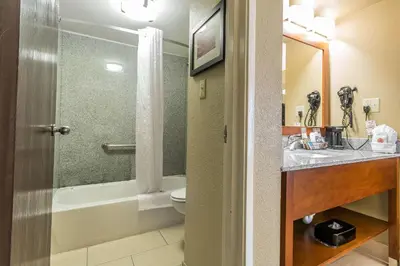 a bathroom with a tub and a sink and a toilet at Comfort Inn & Suites Lexington - Hamburg I-75 in Lexington