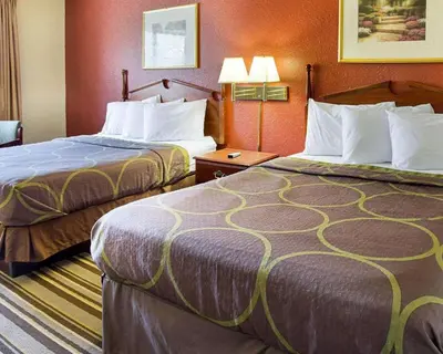 a hotel room with two beds in a room at Rodeway Inn Florence - Cincinnati South in Florence