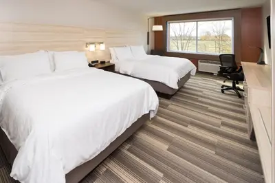 a hotel room with two beds and a window at Holiday Inn Express & Suites - Auburn by IHG in Auburn
