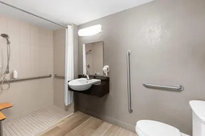 a bathroom with a sink and a toilet at Days Inn by Wyndham Charleston WV in Charleston