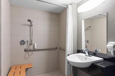 a bathroom with a sink and a shower at Days Inn by Wyndham Charleston WV in Charleston