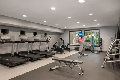 a gym with several treadmills and exercise equipment at Homewood Suites by Hilton Columbus/Polaris in Columbus