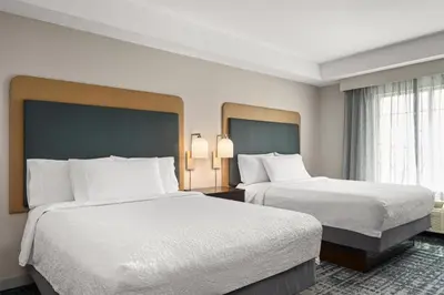 a hotel room with two beds and a window at Homewood Suites by Hilton Columbus/Polaris in Columbus