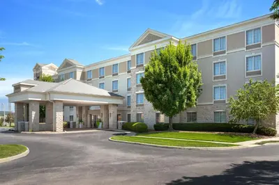 an apartment building with a driveway in front at Homewood Suites by Hilton Columbus/Polaris in Columbus