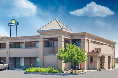 a office building with a sign on top of it at Days Inn by Wyndham Mt. Sterling in Mount Sterling