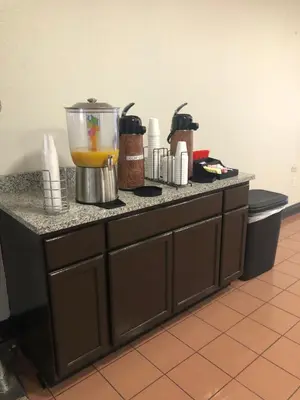 a kitchen counter with a blender on top of it at Red Roof Inn & Suites Lexington - Hamburg in Lexington