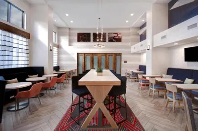 a dining room with tables and chairs in a restaurant at Hampton Inn & Suites Dayton-Vandalia in Murlin Heights