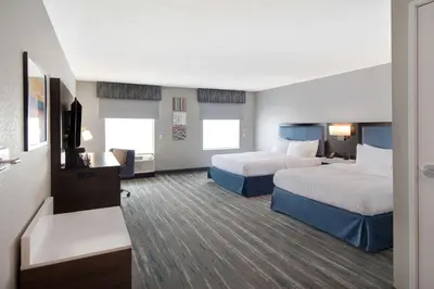 a hotel room with two beds and a flat screen tv at Hampton Inn & Suites Dayton-Vandalia in Murlin Heights