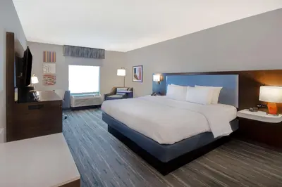 a hotel room with a bed and a television at Hampton Inn & Suites Dayton-Vandalia in Murlin Heights