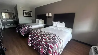 a hotel room with two beds in a room at Red Roof Inn Anderson, IN in Anderson