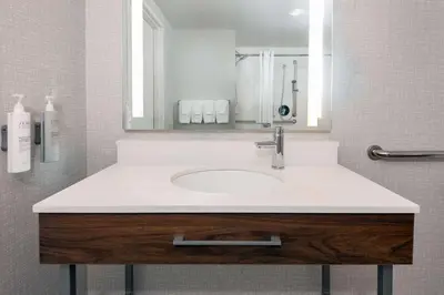 a bathroom with a sink and a mirror at Hampton Inn & Suites Cleveland-Beachwood in Beachwood