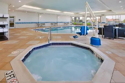 a large swimming pool in a large room with a large at Hampton Inn & Suites Cleveland-Beachwood in Beachwood