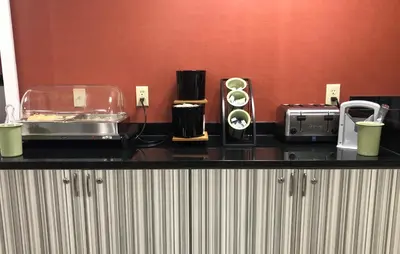 a kitchen counter with various appliances on it at Ramada Limited - Mount Sterling in Mount Sterling