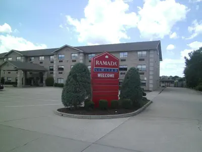 a hotel with a sign in front of a building at Ramada Limited - Mount Sterling in Mount Sterling