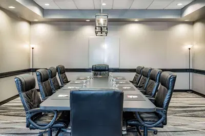 a conference room with a long table and chairs at Howard Johnson by Wyndham Lima in Lima