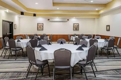 a conference room with tables and chairs in it at Howard Johnson by Wyndham Lima in Lima
