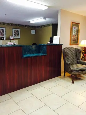 a waiting room with a counter and a chair at Brookshire Inn in Inez