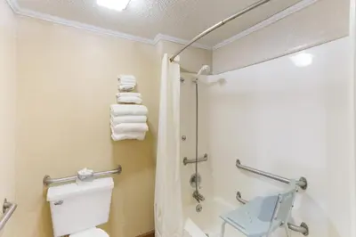a bathroom with a toilet and a shower at Knights Inn Ashland in Ashland