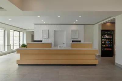 a lobby with a cash register in a store at Hilton Garden Inn Cleveland Airport in Fairview Park