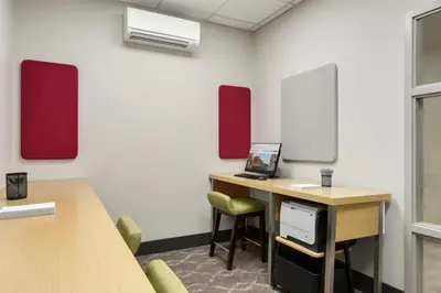 an office with a desk with a laptop on it at Hilton Garden Inn Cleveland Airport in Fairview Park