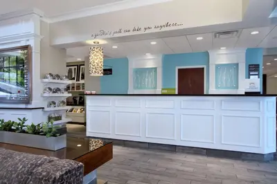 a store lobby with a counter in a store at Hilton Garden Inn Columbus-University Area in Columbus