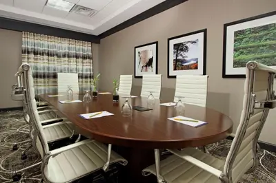a conference room with a wooden table and chairs at Hilton Garden Inn Columbus-University Area in Columbus