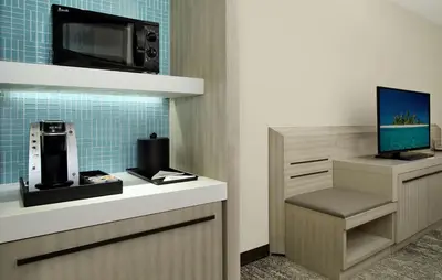a office with a desk with a tv on a counter at Hilton Garden Inn Columbus-University Area in Columbus