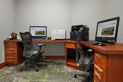 an office with two desks with two computers on them at Hilton Garden Inn Columbus-University Area in Columbus