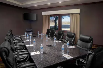a conference room with a long table and chairs at Wyndham Independence in Independence