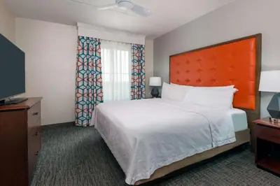 a bedroom with a large bed and a television at Homewood Suites by Hilton Cleveland-Beachwood in Beachwood