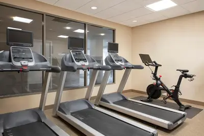 a gym with two treadmills and two ellipticals at Hilton Garden Inn Cleveland Downtown in Cleveland