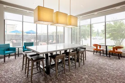 a dining room with a table and chairs at Hilton Garden Inn Cleveland Downtown in Cleveland