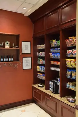 a grocery store aisle with shelves of food at Hilton Garden Inn Columbus/Polaris in Columbus