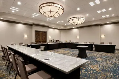 a large conference room with a long table and chairs at Embassy Suites by Hilton Columbus in Columbus