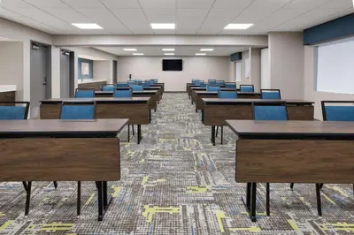 a classroom with desks and chairs in a room at Hampton Inn Cleveland-Airport/Tiedeman Road in Brooklyn