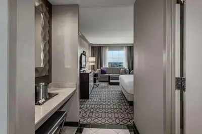 a hotel room with a bed and a bathroom at Hilton Columbus at Easton in Columbus