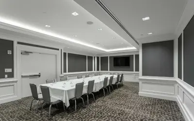 a conference room with a long table and chairs at Hilton Columbus at Easton in Columbus