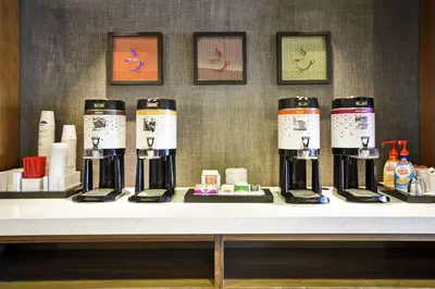 a table with four coffee machines on it at Hampton Inn & Suites Columbus-Easton Area in Columbus