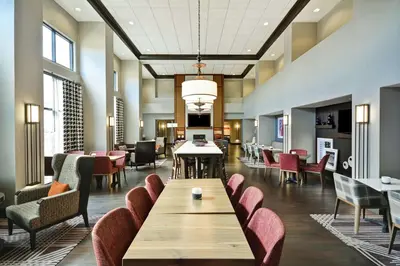 a lobby with chairs and a table in a hospital at Hampton Inn & Suites Columbus-Easton Area in Columbus