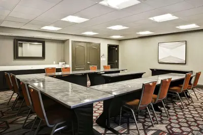 a conference room with a large table and chairs at Hampton Inn & Suites Columbus-Easton Area in Columbus