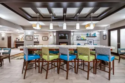 a dining room with a large table and chairs at Hampton Inn West in Columbus