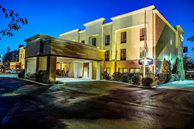 a rendering of a hotel building at night at Hampton Inn Columbus I-70E/Hamilton Road in Columbus