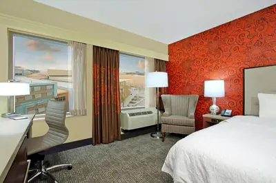 a hotel room with a bed and a window at Hampton Inn & Suites Columbus-Downtown, Ohio in Columbus