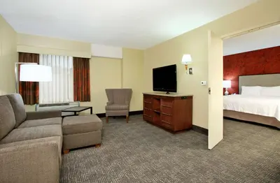 a hotel room with a bed and a flat screen tv at Hampton Inn & Suites Columbus-Downtown, Ohio in Columbus