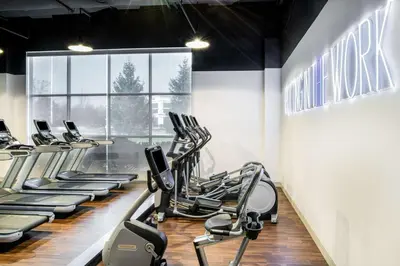 a gym with rows of treadmills and elliptical machines at Hilton Columbus/Polaris in Columbus