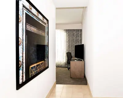 a hallway with a large painting on a wall at Hilton Columbus/Polaris in Columbus