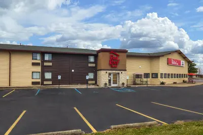 a hotel parking lot in front of a building at Red Roof Inn Perrysburg in Perrysburg