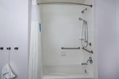 a shower in a bathroom with a shower curtain at Hampton Inn Weston, WV in Weston