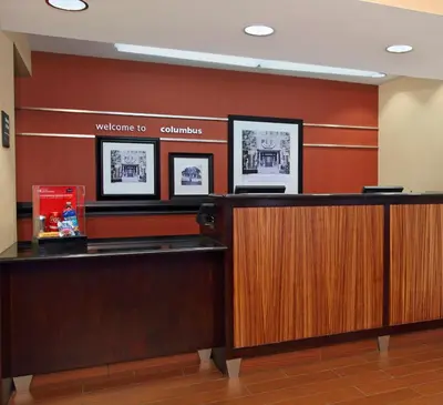 a welcome desk in a waiting room at Hampton Inn Columbus-International Airport in Gahanna