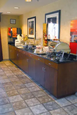 a kitchen with a counter with food on it at Hampton Inn Columbus-International Airport in Gahanna